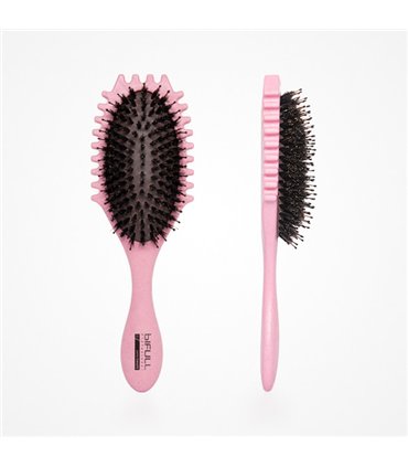 Pink boar bristle hair brush with a textured edge.